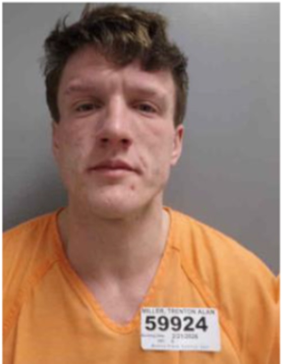 Mugshot of a man in an orange prison uniform with inmate number 59924 on his chest.