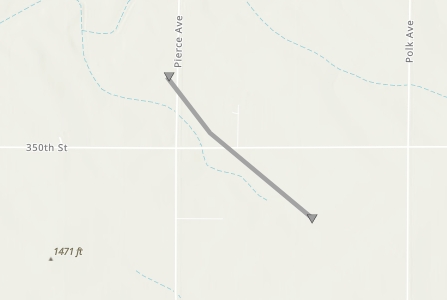Gray diagonal line with arrowheads at both ends crossing a rural map from near Pierce Ave to the southeast across 350th St; indicates a route or path on the map, with an elevation marker of 1471 ft nearby.