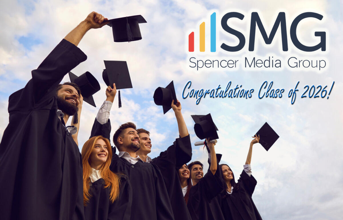 Group of graduates in caps and gowns cheering, with ISMG Spencer Media Group logo and 'Congratulations Class of 2026!' text in the sky.