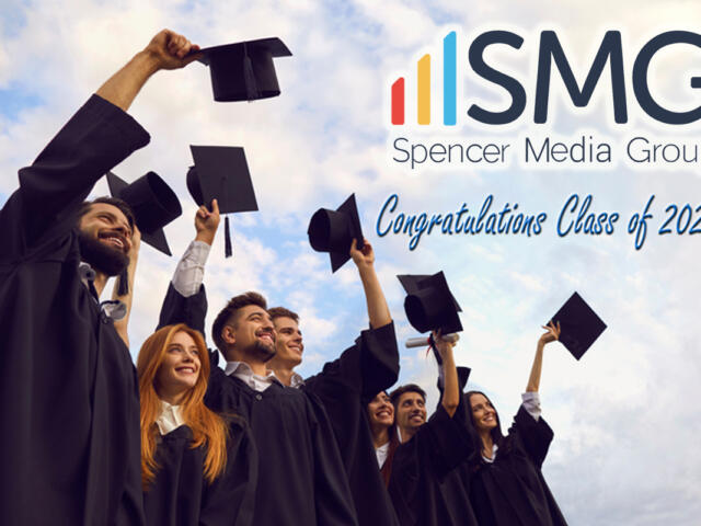 Group of graduates in caps and gowns cheering, with ISMG Spencer Media Group logo and 'Congratulations Class of 2026!' text in the sky.