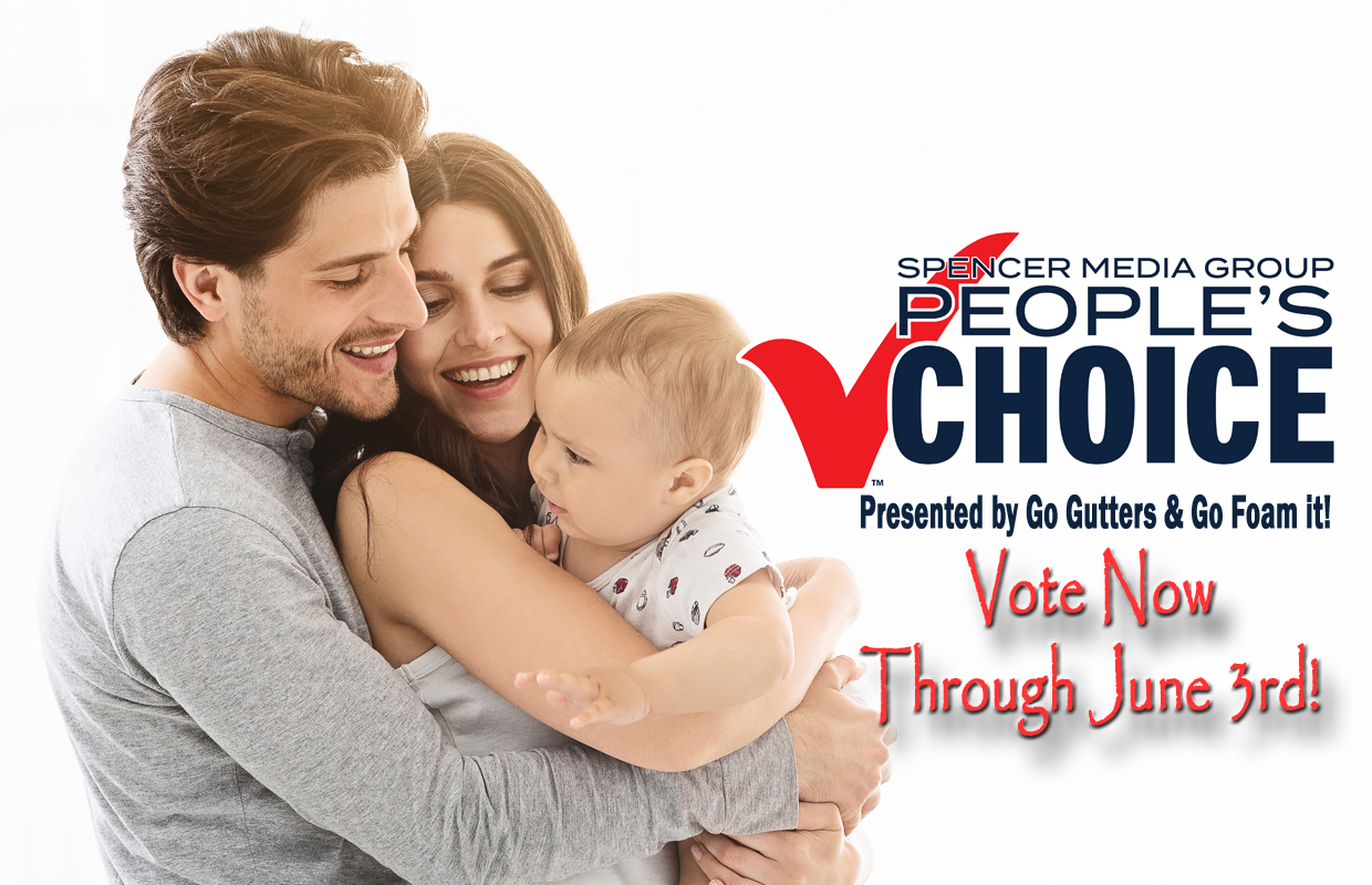 Family of three (man, woman, baby) smiling and embracing; ad text reads "Spencer Media Group PEOPLE'S CHOICE" with 'Vote Now Through June 3rd!' nearby.
