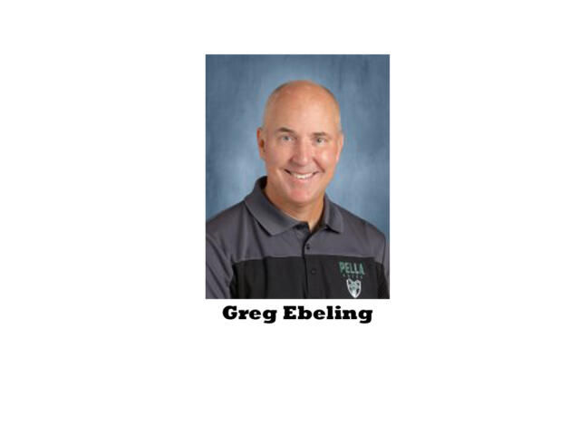 Portrait of Greg Ebeling, smiling, wearing a gray polo with a Pella logo against a blue background.