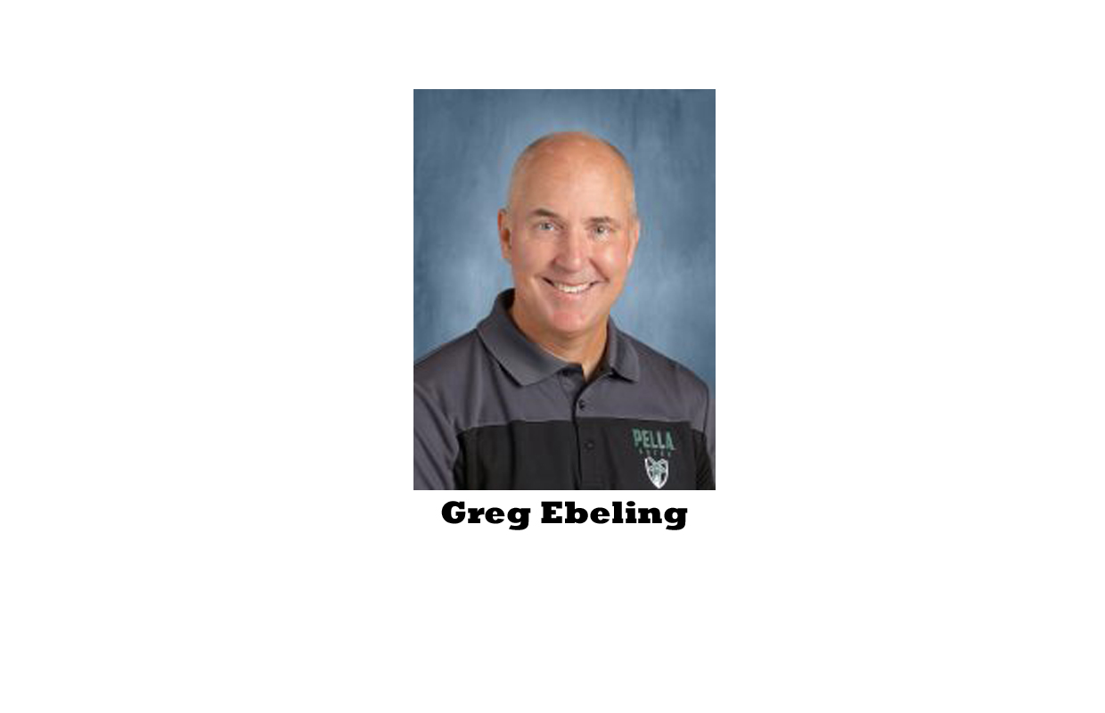 Portrait of Greg Ebeling, smiling, wearing a gray polo with a Pella logo against a blue background.