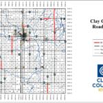 Clay County, Iowa road map showing highways, paved roads, and 55 mph zones (red), with blue rivers and a street grid; legend and Clay County logo on the right.