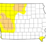 Map of Iowa with yellow and tan shading indicating drought zones predominantly in the western half of the state; white areas are unaffected.