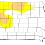 Iowa map highlighting drought in the northwest with yellow (moderate) and orange (severe) areas.